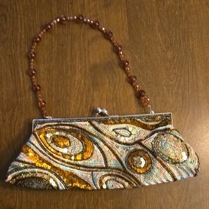 Artistic Beaded Clutch with Gold and Brown Accents